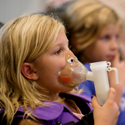 Abigail McLain, 6, does her breathing treatments.