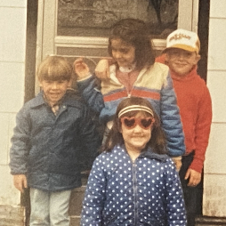 Andy (in red) with cousin Greg, Holly (in stripes) and, Sara (in polka dots) - at Granny Irma's farm in Corning, AR.