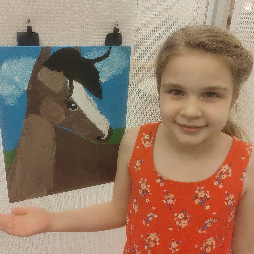 JenniLynn's painting is displayed at the public library.