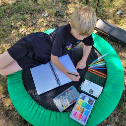 young artist sketching