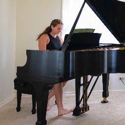 Faith playing on our new-to-us Steinway before leaving for Croatia, 2/2024.