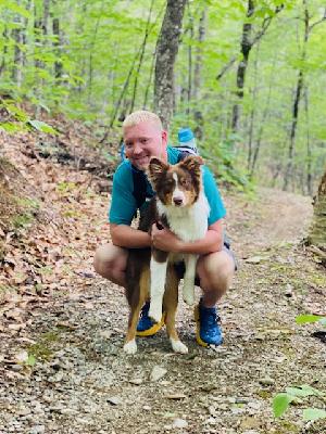 Rey and his dog Kona on a Hike