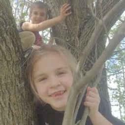 JenniLyn loves playing outside with her brothers.